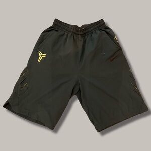 Nike Teal Athletic Shorts with Yellow Accents